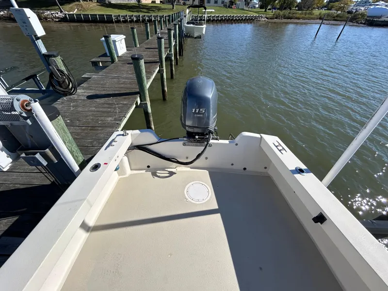Slide: The Image of 2014 Seaway 21 Seafarer Cuddy boat docked with outboard motor, viewed from stern. - 10