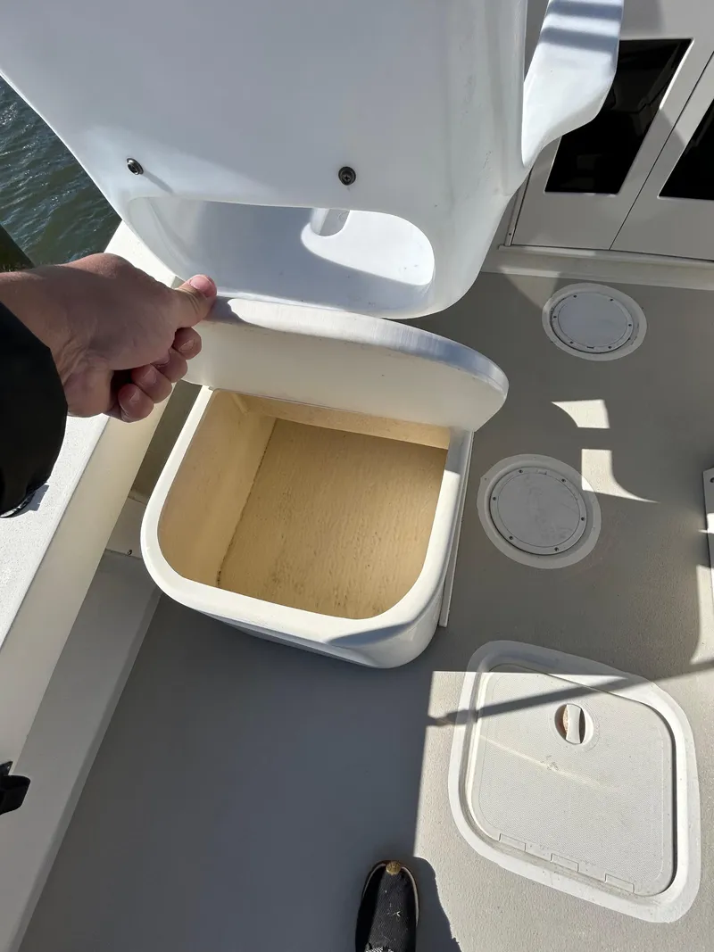 Slide: The Image of Open storage compartment on 2014 Seaway 21 Seafarer Cuddy boat deck. - 12