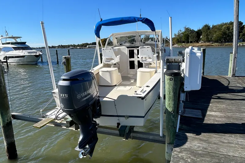 Slide: The Image of 2014 Seaway 21 Seafarer Cuddy boat docked with Yamaha 115 outboard motor. - 14