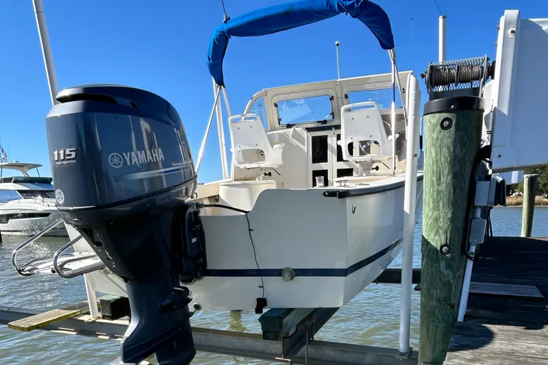 Slide: The Image of 2014 Seaway 21 Seafarer Cuddy with Yamaha 115 engine docked at marina. - 19