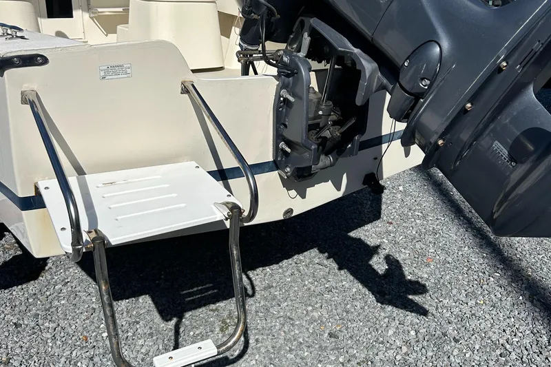 Slide: The Image of 2014 Seaway 21 Seafarer Cuddy boat stern with ladder and motor detail. - 20