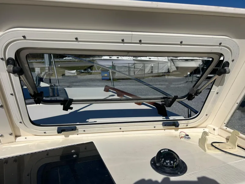 Slide: The Image of 2014 Seaway 21 Seafarer Cuddy windshield and compass view. - 5
