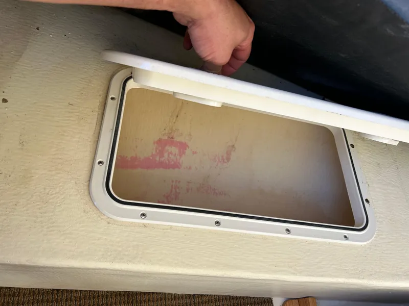 Slide: The Image of Open storage compartment on a 2014 Seaway 21 Seafarer Cuddy boat. - 6