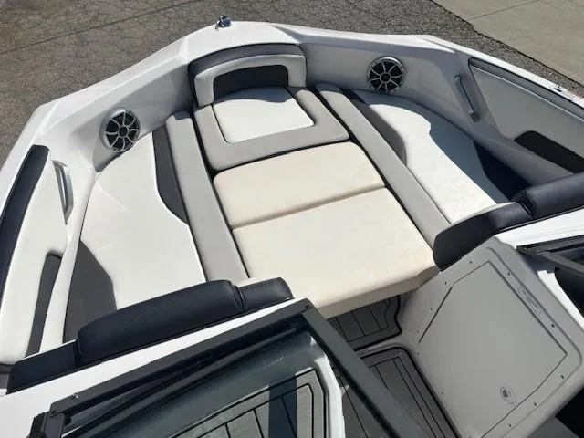 Slide: The Image of 2020 Yamaha Boats 195S interior with cushioned seating and built-in speakers. - 10