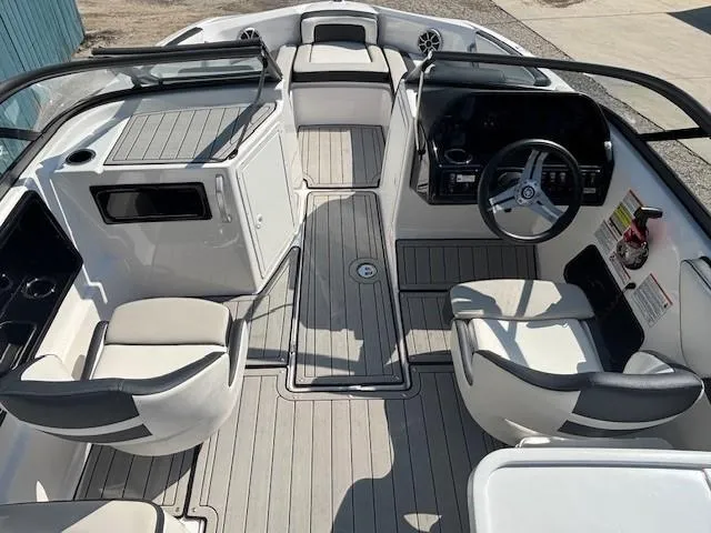 Slide: The Image of 2020 Yamaha Boats 195S interior with sleek seating and modern dashboard design. - 11