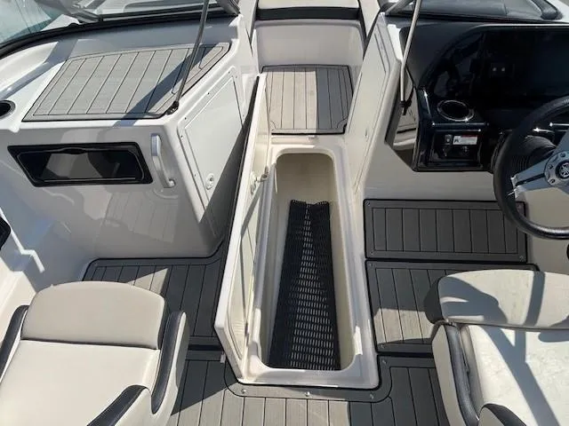 Slide: The Image of 2020 Yamaha Boats 195S interior with open storage compartment and seating. - 12