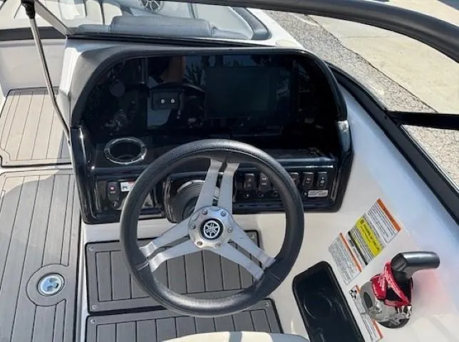 Slide: The Image of 2020 Yamaha Boats 195S dashboard with steering wheel and control panel. - 14