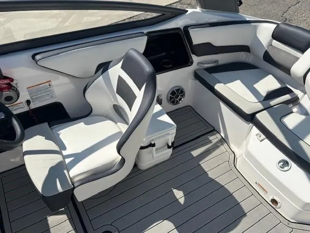 Slide: The Image of 2020 Yamaha Boats 195S interior with white and black seating, modern dashboard, and sleek design. - 15