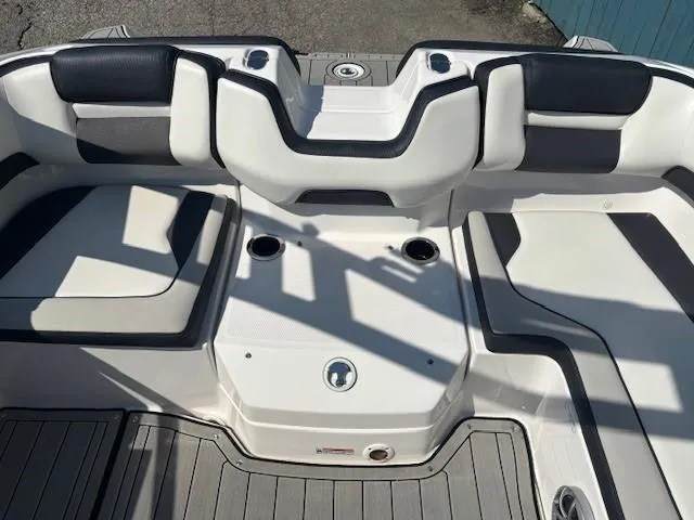 Slide: The Image of 2020 Yamaha Boats 195S interior with cushioned seating and cup holders. - 21