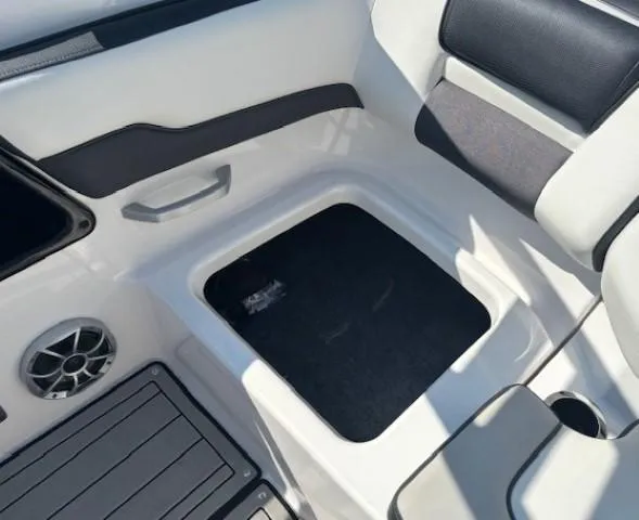 Slide: The Image of 2020 Yamaha Boats 195S interior seating with storage compartment and speaker. - 22