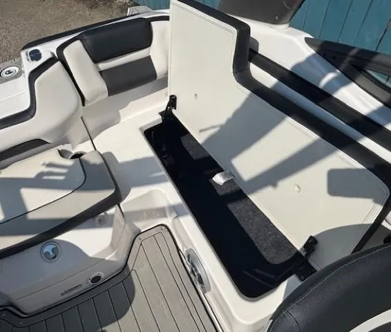 Slide: The Image of Interior view of a 2020 Yamaha Boats 195S, showcasing seating and storage area. - 24