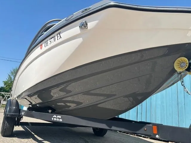 Slide: The Image of 2020 Yamaha Boats 195S on trailer, side view, clear sky background. - 3