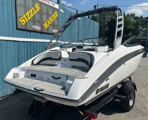 Slide: The Image of 2020 Yamaha Boats 195S on trailer, displayed at Sizzle Marine dealership. - 4