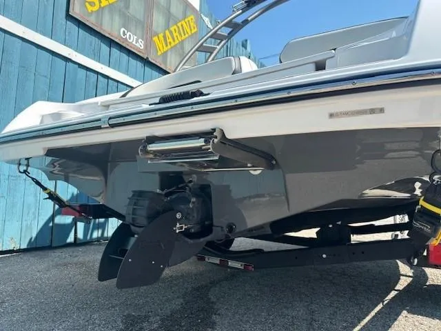 Slide: The Image of 2020 Yamaha Boats 195S rear view, showcasing the boat's sleek design and propeller system. - 6