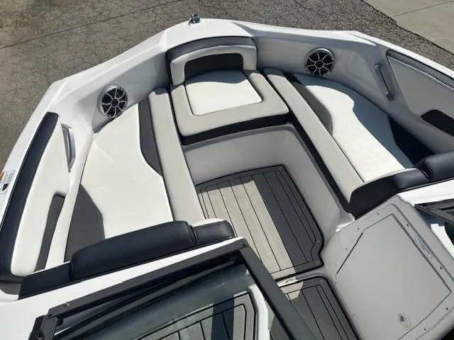 Slide: The Image of 2020 Yamaha Boats 195S interior with white seating and speakers. - 8