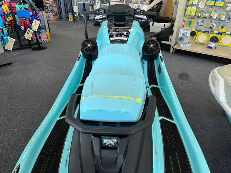 Slide: The Image of 2025 Yamaha WaveRunner VX Limited Ho in showroom, featuring turquoise seat and sleek design. - 2