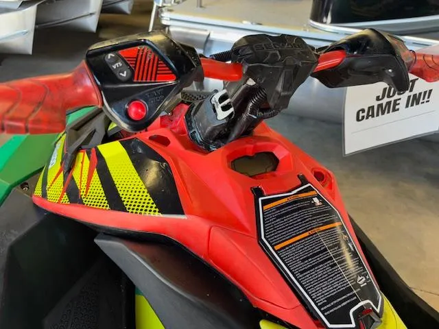 Slide: The Image of 2021 Sea-Doo SPARK TRIXX 3up handlebars with vibrant red and yellow design. - 10