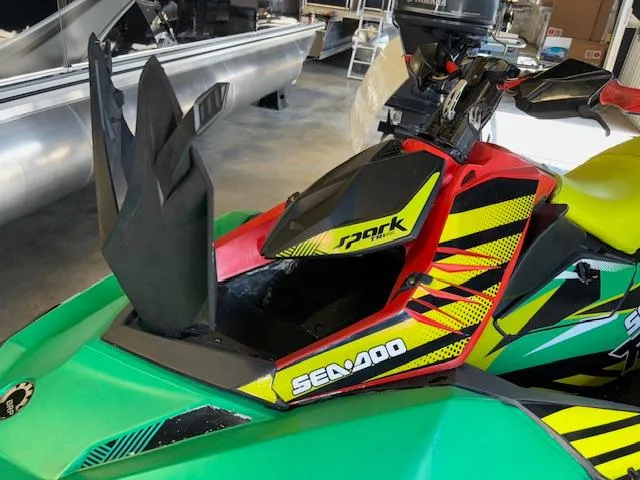 Slide: The Image of 2021 Sea-Doo SPARK TRIXX 3up jet ski with vibrant graphics and unique handlebar design. - 11