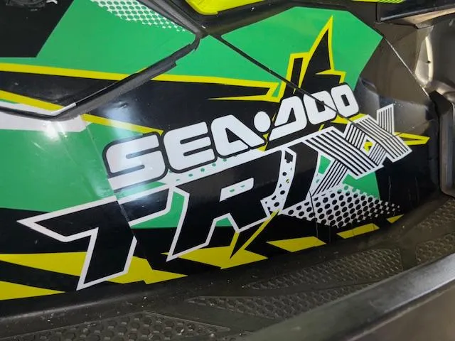 Slide: The Image of 2021 Sea-Doo SPARK TRIXX 3up with vibrant green and black graphics. - 12