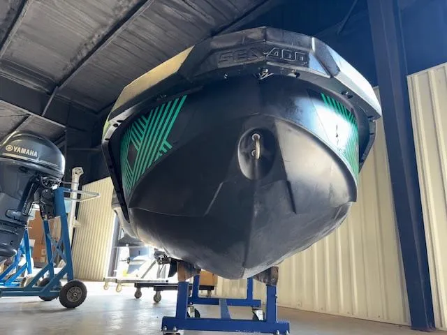 Slide: The Image of 2021 Sea-Doo SPARK TRIXX 3up jet ski in storage, front view. - 13