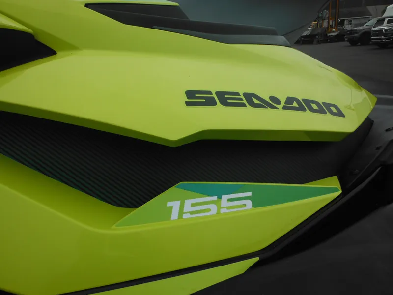 Slide: The Image of 2019 Sea-Doo GTI SE 155, lime green exterior, close-up view of branding and model number. - 13