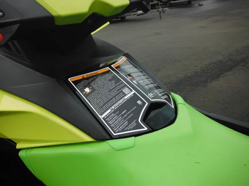 Slide: The Image of 2019 Sea-Doo GTI SE 155 dashboard with warning labels, lime green color. - 22