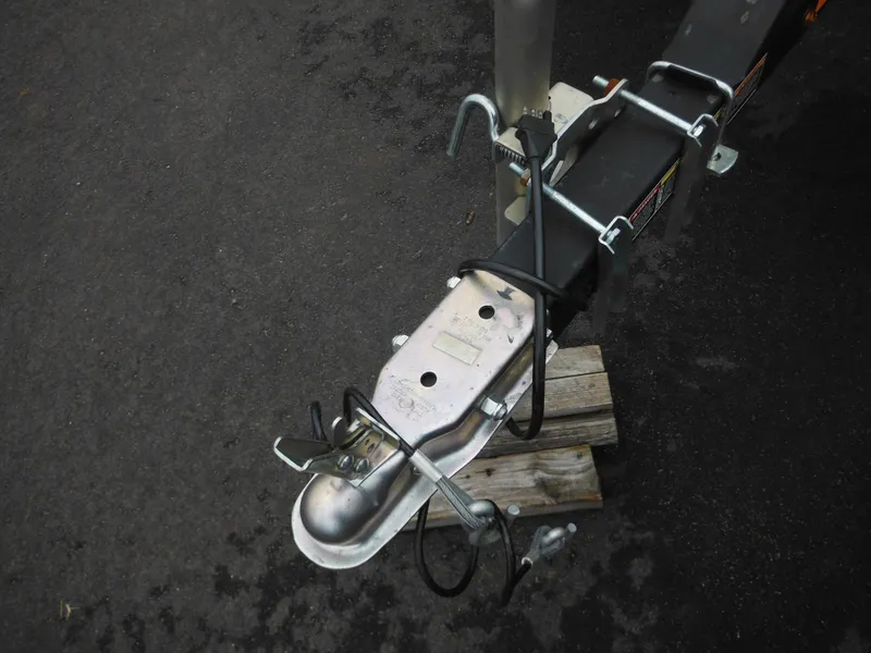 Slide: The Image of Trailer hitch for 2019 Sea-Doo GTI SE 155 on asphalt surface. - 32