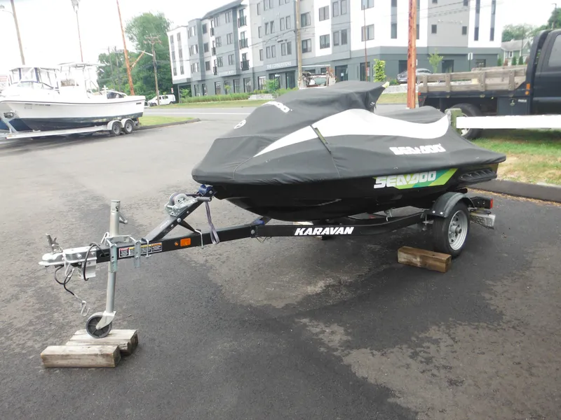 Slide: The Image of 2019 Sea-Doo GTI SE 155 on Karavan trailer, covered, parked outdoors. - 4