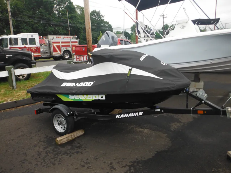 Slide: The Image of 2019 Sea-Doo GTI SE 155 jet ski covered on a Karavan trailer. - 5