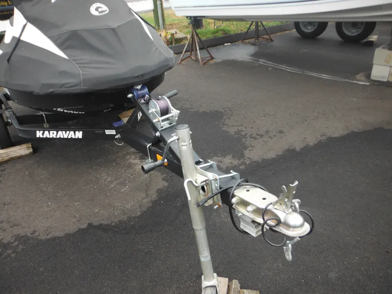 Slide: The Image of 2019 Sea-Doo GTI SE 155 on Karavan trailer, covered and parked on asphalt. - 6