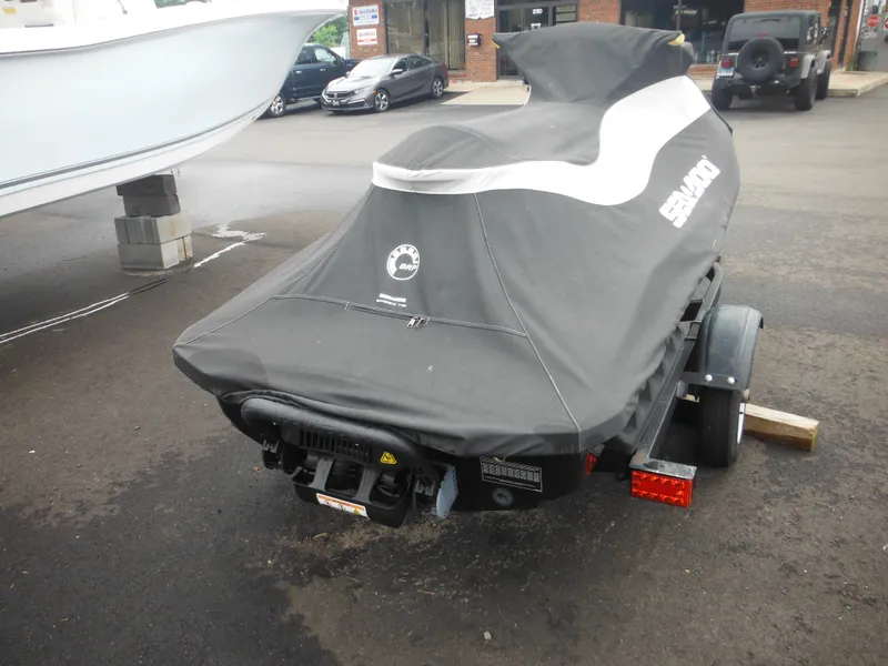 Slide: The Image of 2019 Sea-Doo GTI SE 155 covered on trailer in parking lot. - 7