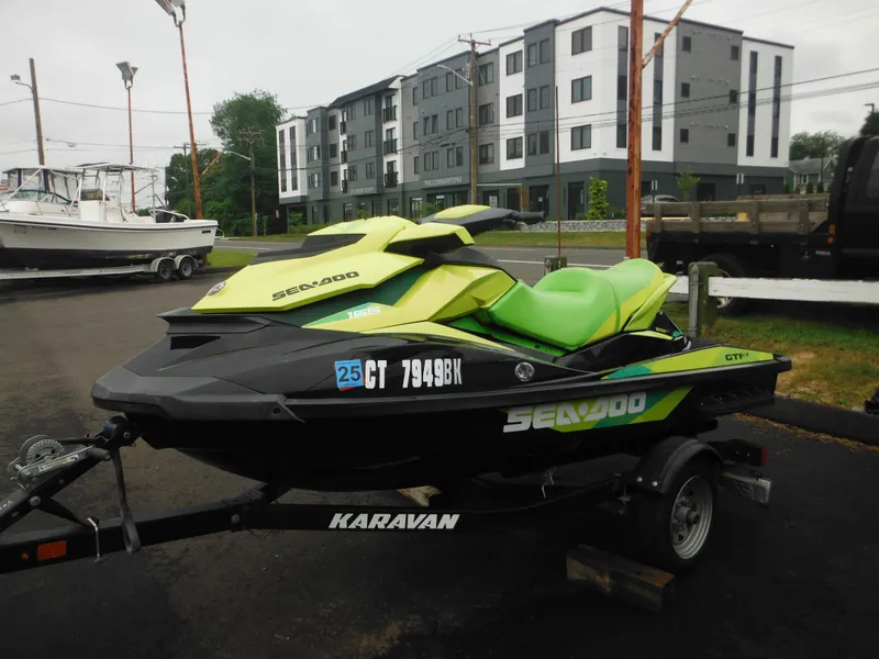 Slide: The Image of 2019 Sea-Doo GTI SE 155 jet ski on trailer, parked outdoors. - 9