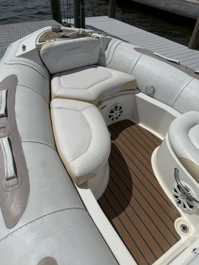 Slide: The Image of 2018 Zodiac Avon boat interior with cushioned seating and wood-style flooring. - 9