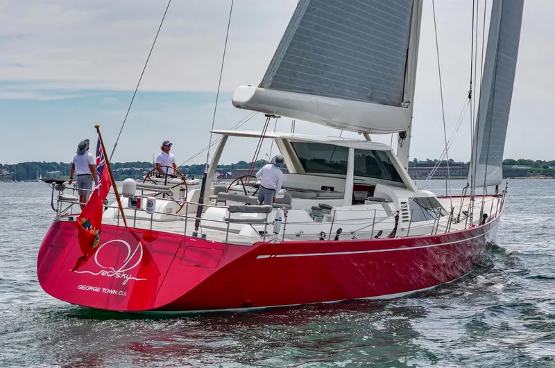 Slide: The Image of Red Nautor Swan 100 Pilothouse yacht sailing, 2003 model, with crew on deck. - 12