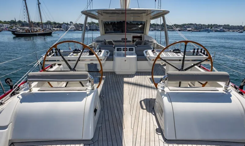 Slide: The Image of Luxurious 2003 Nautor Swan 100 Pilothouse yacht deck with dual steering wheels. - 15
