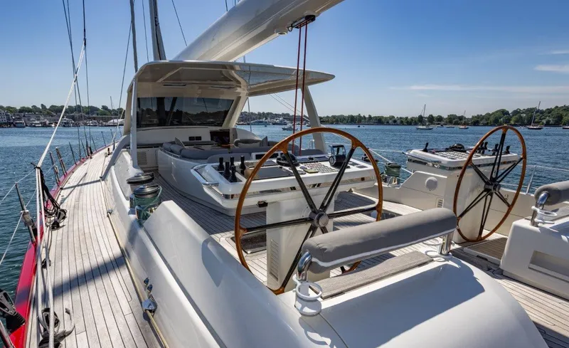 Slide: The Image of Luxurious 2003 Nautor Swan 100 Pilothouse yacht with dual steering wheels on a sunny day. - 16