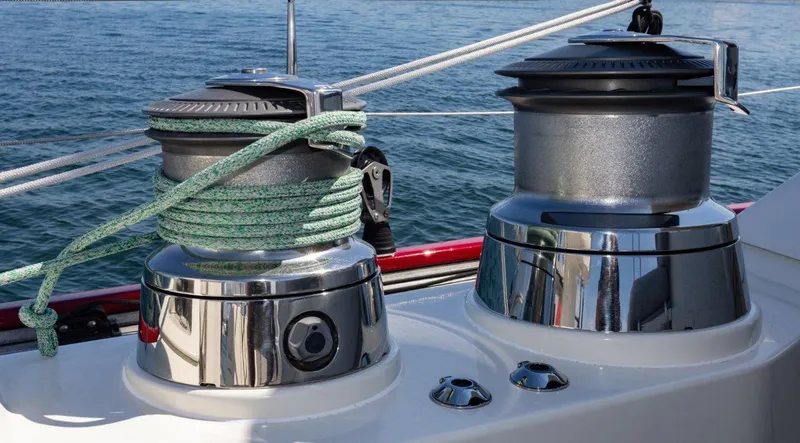 Slide: The Image of Winches on a 2003 Nautor Swan 100 Pilothouse yacht, with ropes and ocean background. - 19