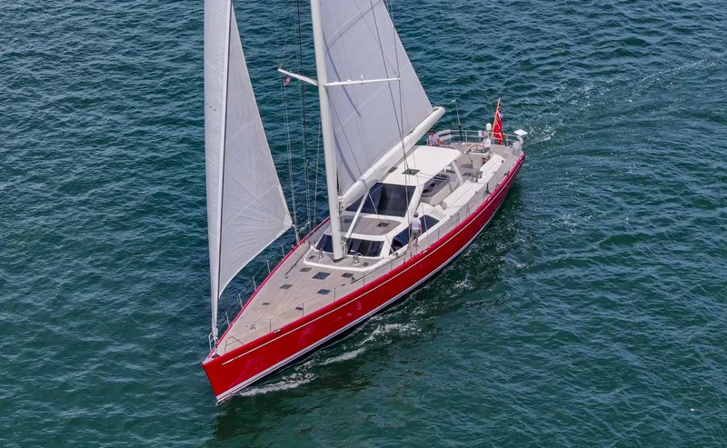 Slide: The Image of Red Nautor Swan 100 Pilothouse yacht sailing on open water, 2003 model. - 2