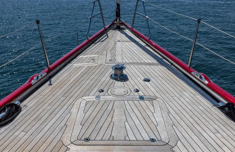 Slide: The Image of Deck of 2003 Nautor Swan 100 Pilothouse yacht with red railings on open water. - 21