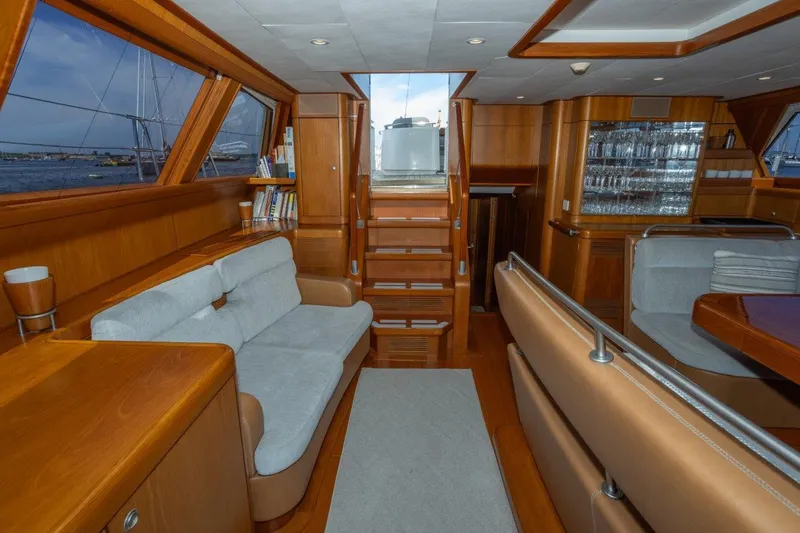 Slide: The Image of Luxurious interior of 2003 Nautor Swan 100 Pilothouse yacht with wooden finishes and seating. - 24