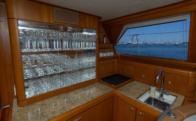 Slide: The Image of Luxurious interior of 2003 Nautor Swan 100 Pilothouse yacht with glassware and ocean view. - 25