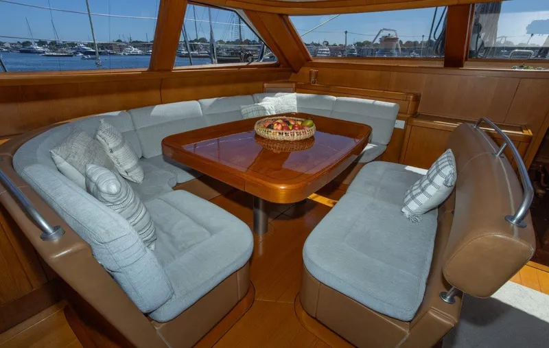 Slide: The Image of Luxurious interior of 2003 Nautor Swan 100 Pilothouse with elegant seating and wooden table. - 26