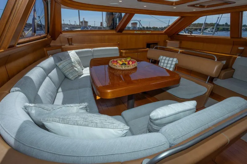 Slide: The Image of Luxurious interior of 2003 Nautor Swan 100 Pilothouse with elegant seating and wooden table. - 28