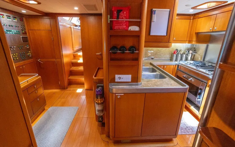 Slide: The Image of Luxurious 2003 Nautor Swan 100 Pilothouse yacht interior with modern kitchen and control panel. - 30