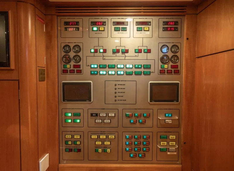Slide: The Image of Control panel of a 2003 Nautor Swan 100 Pilothouse yacht, featuring gauges and switches. - 31