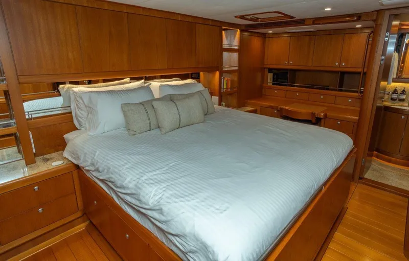 Slide: The Image of Luxurious bedroom interior of 2003 Nautor Swan 100 Pilothouse yacht with wooden furnishings. - 33