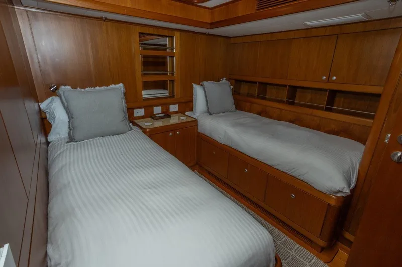 Slide: The Image of Luxurious twin cabin in 2003 Nautor Swan 100 Pilothouse yacht, featuring elegant wood paneling. - 37