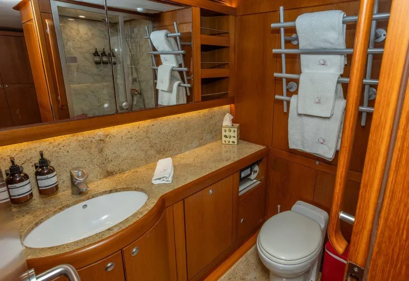 Slide: The Image of Luxurious bathroom in 2003 Nautor Swan 100 Pilothouse yacht with wooden cabinetry and marble accents. - 38