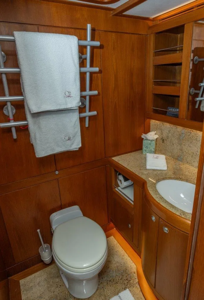 Slide: The Image of Luxurious bathroom in 2003 Nautor Swan 100 Pilothouse yacht with wooden cabinetry and modern fixtures. - 42