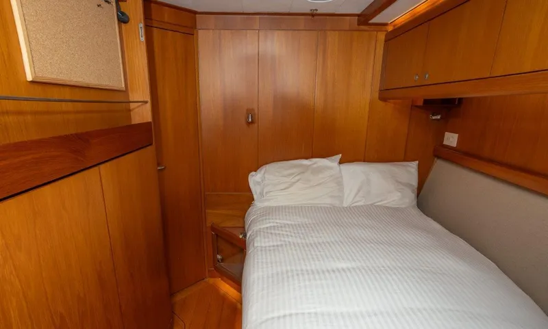 Slide: The Image of Cozy cabin interior of 2003 Nautor Swan 100 Pilothouse yacht with wooden paneling. - 44
